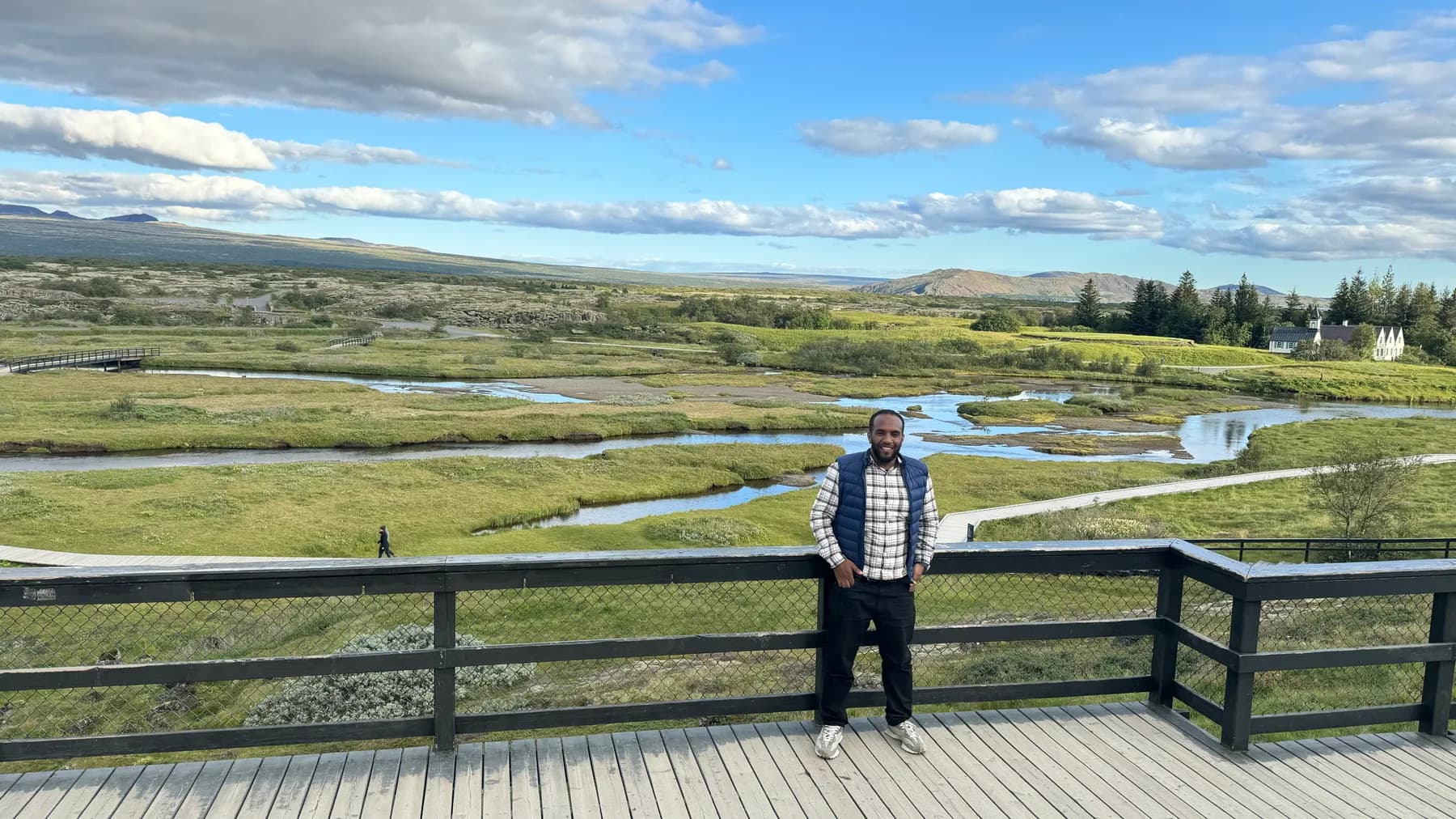 Abduselam overlooking Iceland's rivers, moss-covered fields, and volcanic landscape